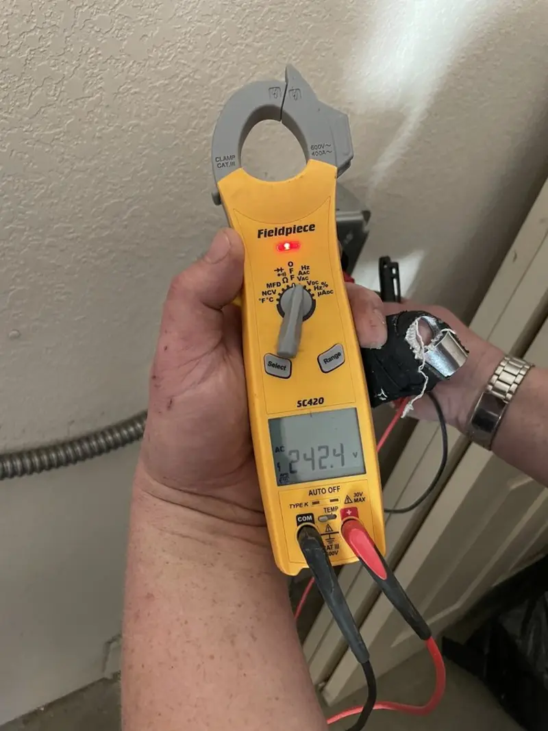 Voltage testing with clamp meter during Generator Installation in Melbourne Beach